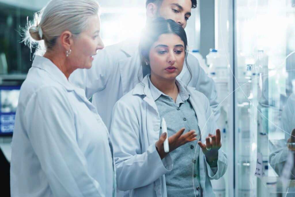 Clinical experts reviewing and discussing patient data in a laboratory setting as part of an independent critical event assessment process