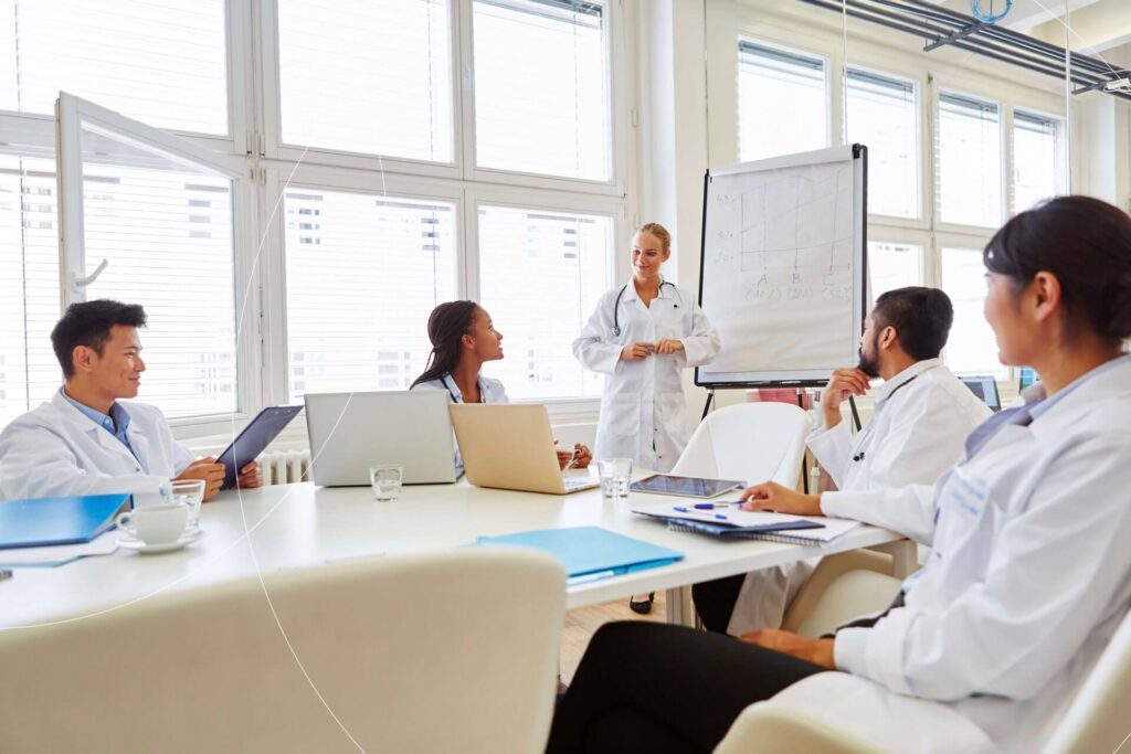 Healthcare professionals navigating challenges in a cardiovascular device trial meeting