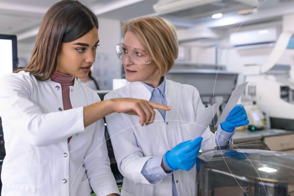 Research team analyzing cardiovascular medical device data in a laboratory